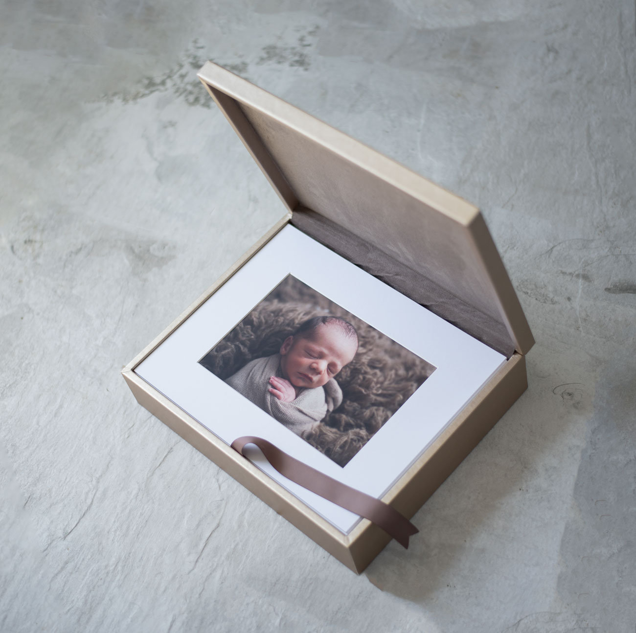 newborn photoshoot image in Sutherland Photography folio box