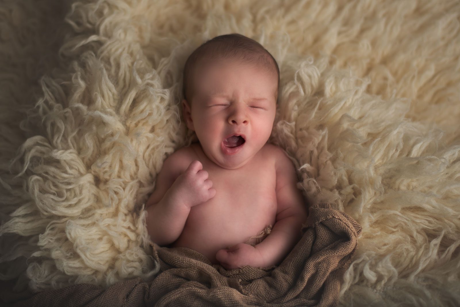 best time for a newborn photoshoot newborn yawning