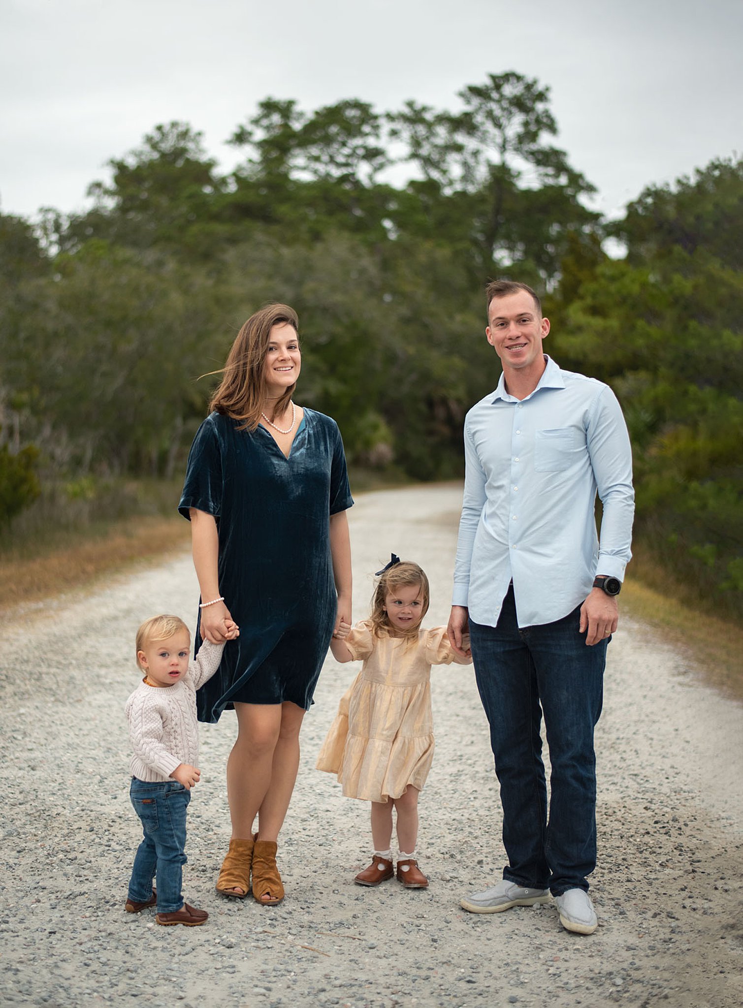 family of four standing on a gravel road Circle of Knowledge